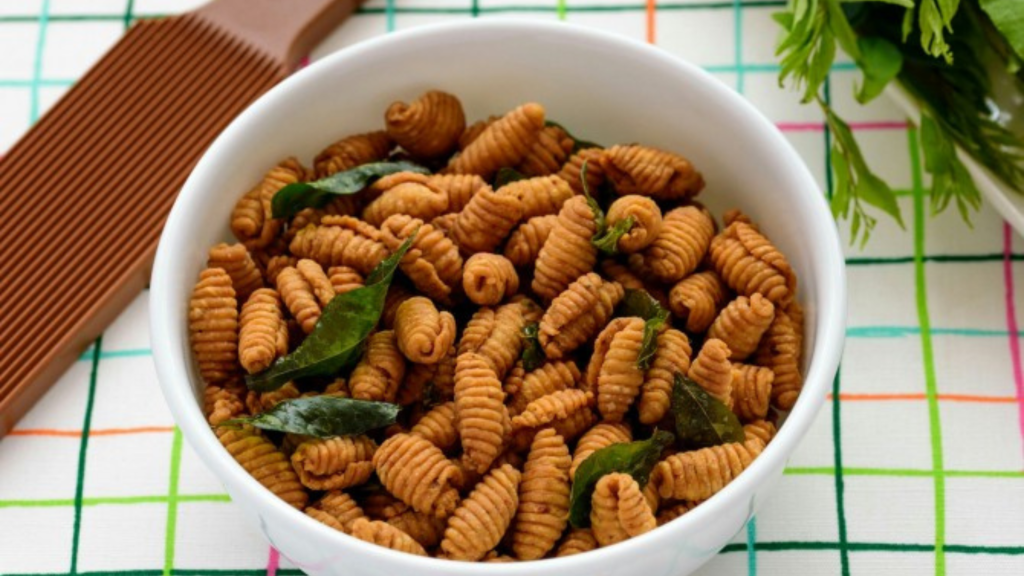 Malay festive savoury snack kuih siput with curry leaves